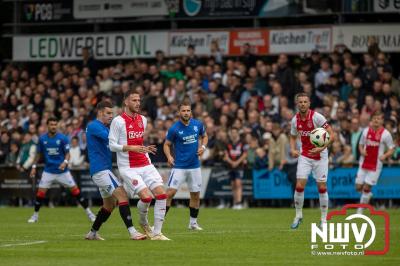 Bezoekers van een afgeladen Sportpark Mulderssingel in Wezep zien Ajax met 2-1 winnen in het oefenduel tegen Rangers FC. - © NWVFoto.nl