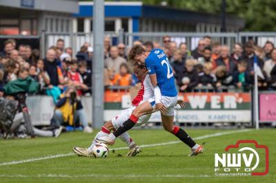 Bezoekers van een afgeladen Sportpark Mulderssingel in Wezep zien Ajax met 2-1 winnen in het oefenduel tegen Rangers FC. - © NWVFoto.nl