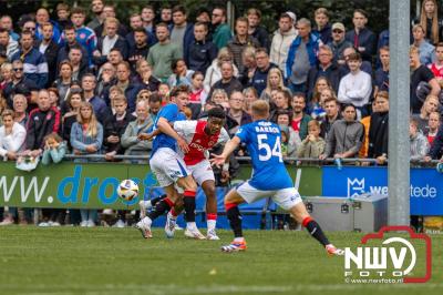 Bezoekers van een afgeladen Sportpark Mulderssingel in Wezep zien Ajax met 2-1 winnen in het oefenduel tegen Rangers FC. - © NWVFoto.nl