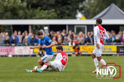 Bezoekers van een afgeladen Sportpark Mulderssingel in Wezep zien Ajax met 2-1 winnen in het oefenduel tegen Rangers FC. - © NWVFoto.nl